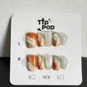 Amber Grey Marble press-on nail set on a TipPop Nails card