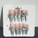 Aqua Gem Stiletto press-on nail set on a TipPop Nails card