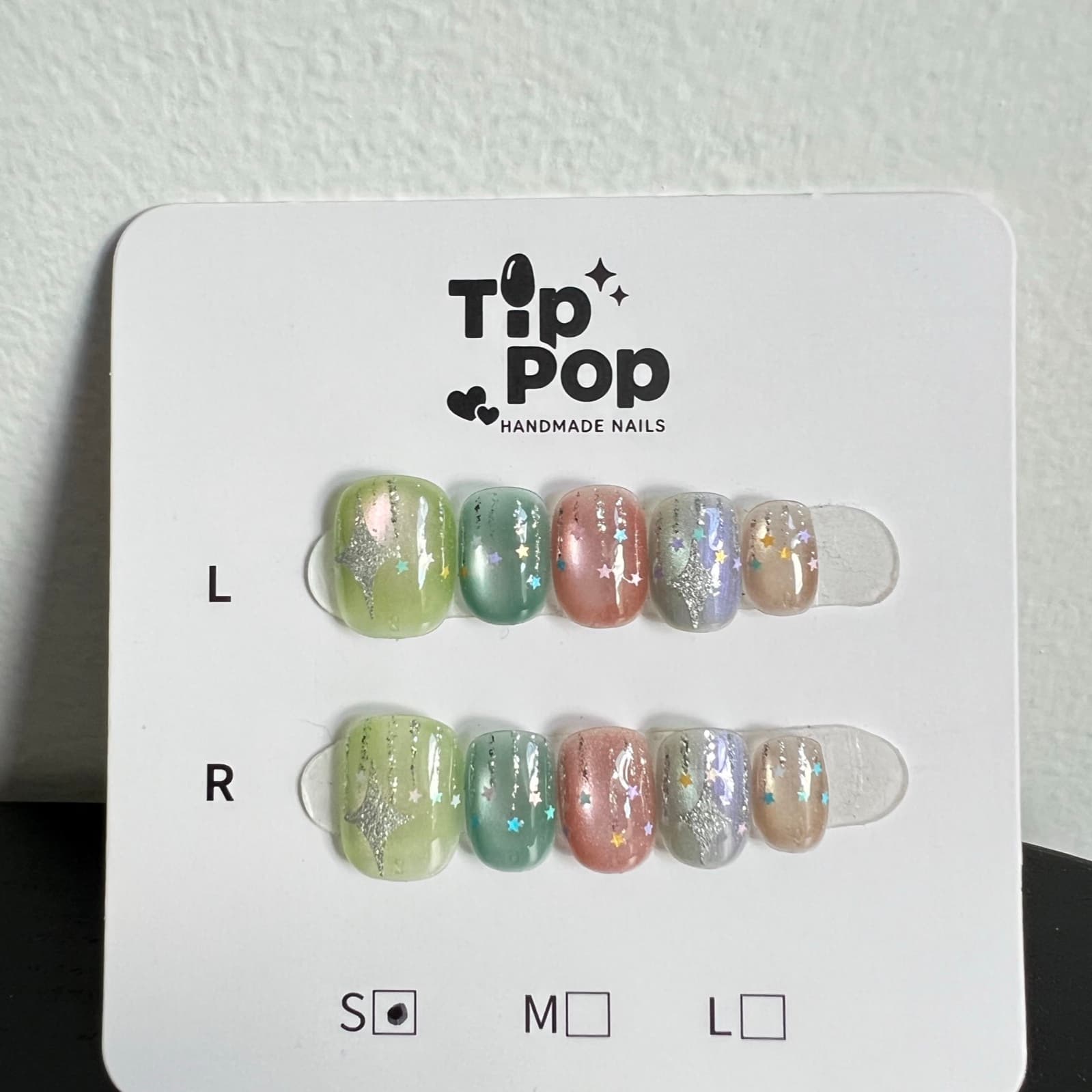 Confetti Star Pastel press-on nail set on a TipPop Nails card