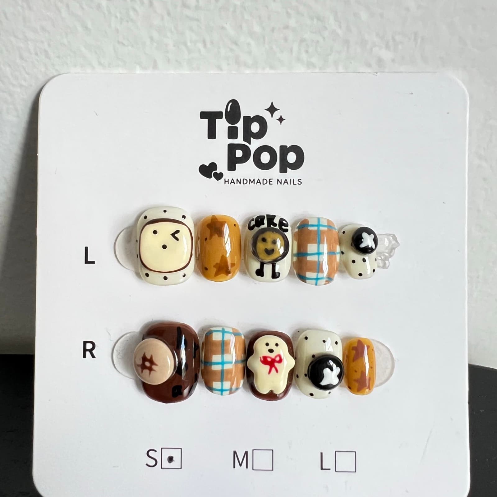 Cookie Bear Doodle press-on nail set on a TipPop Nails card