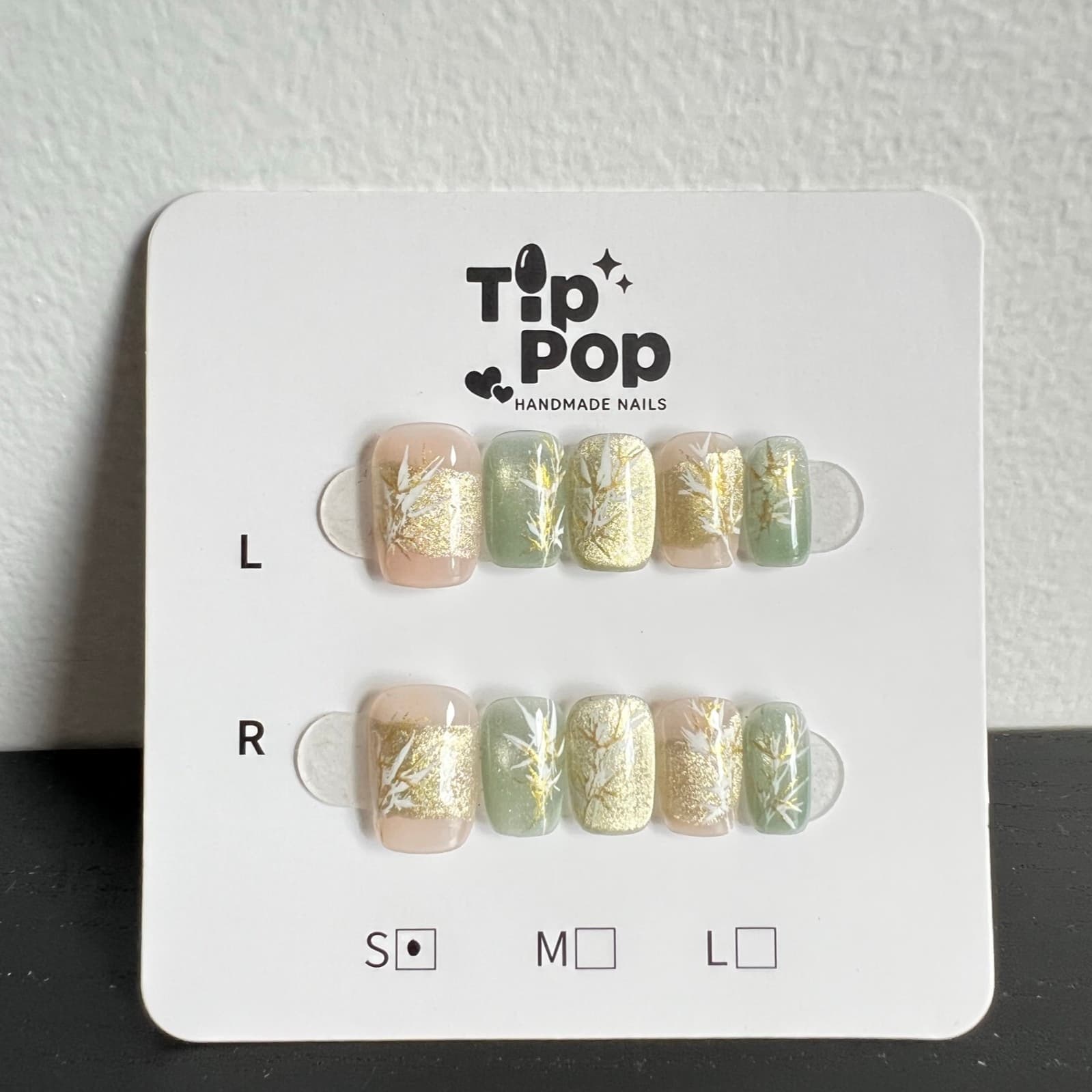 Gilded Branch Sage press-on nail set on a TipPop Nails card