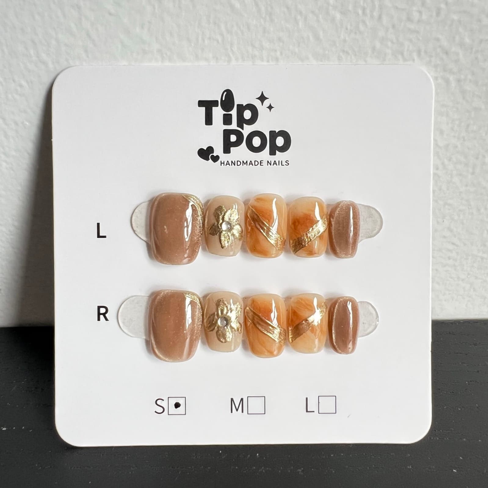 Golden Floral Stripe press-on nail set on a TipPop Nails card