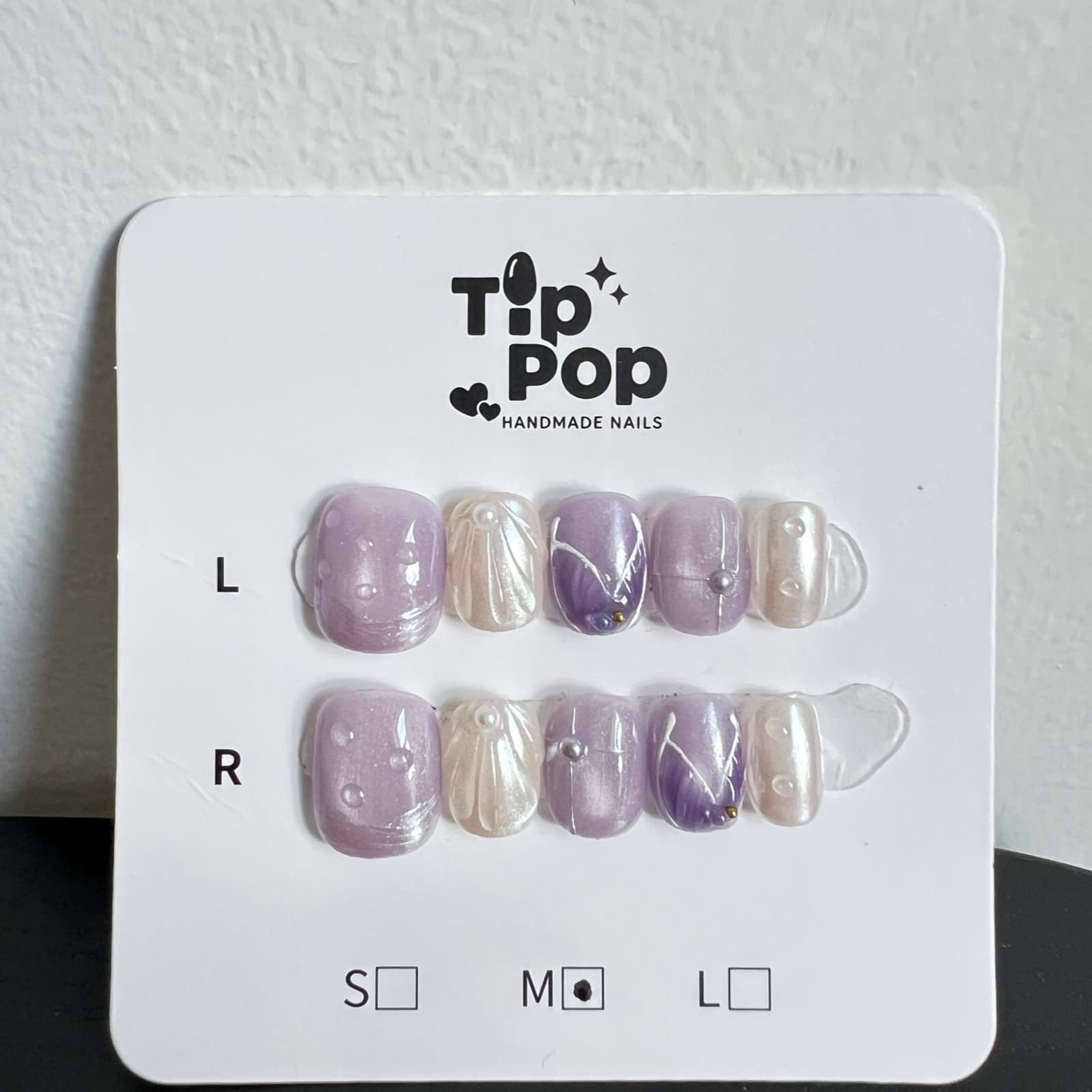Lilac Pearl Marble press-on nail set on a TipPop Nails card
