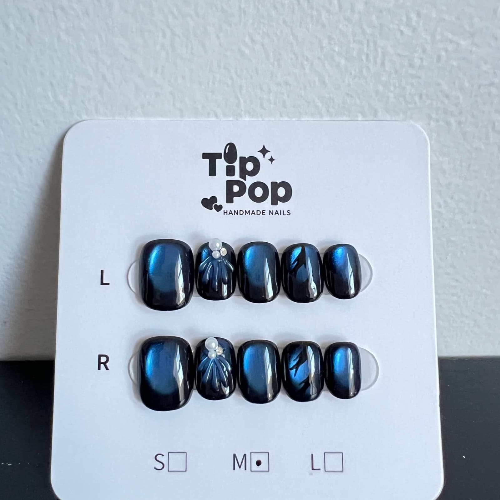 Navy Lightning Leaf press-on nail set on a TipPop Nails card