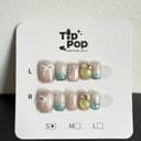 Sage Apple Bow press-on nail set on a TipPop Nails card