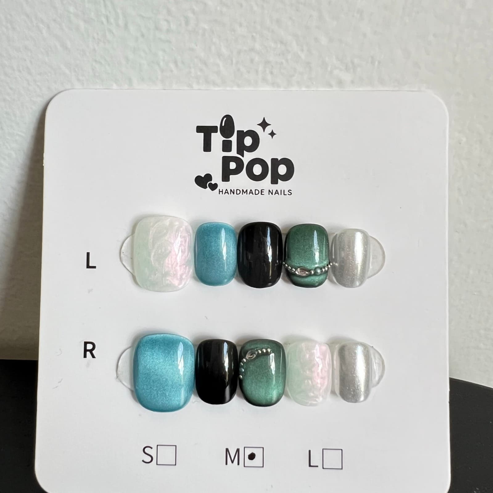 Sage Chain Cat-Eye press-on nail set on a TipPop Nails card
