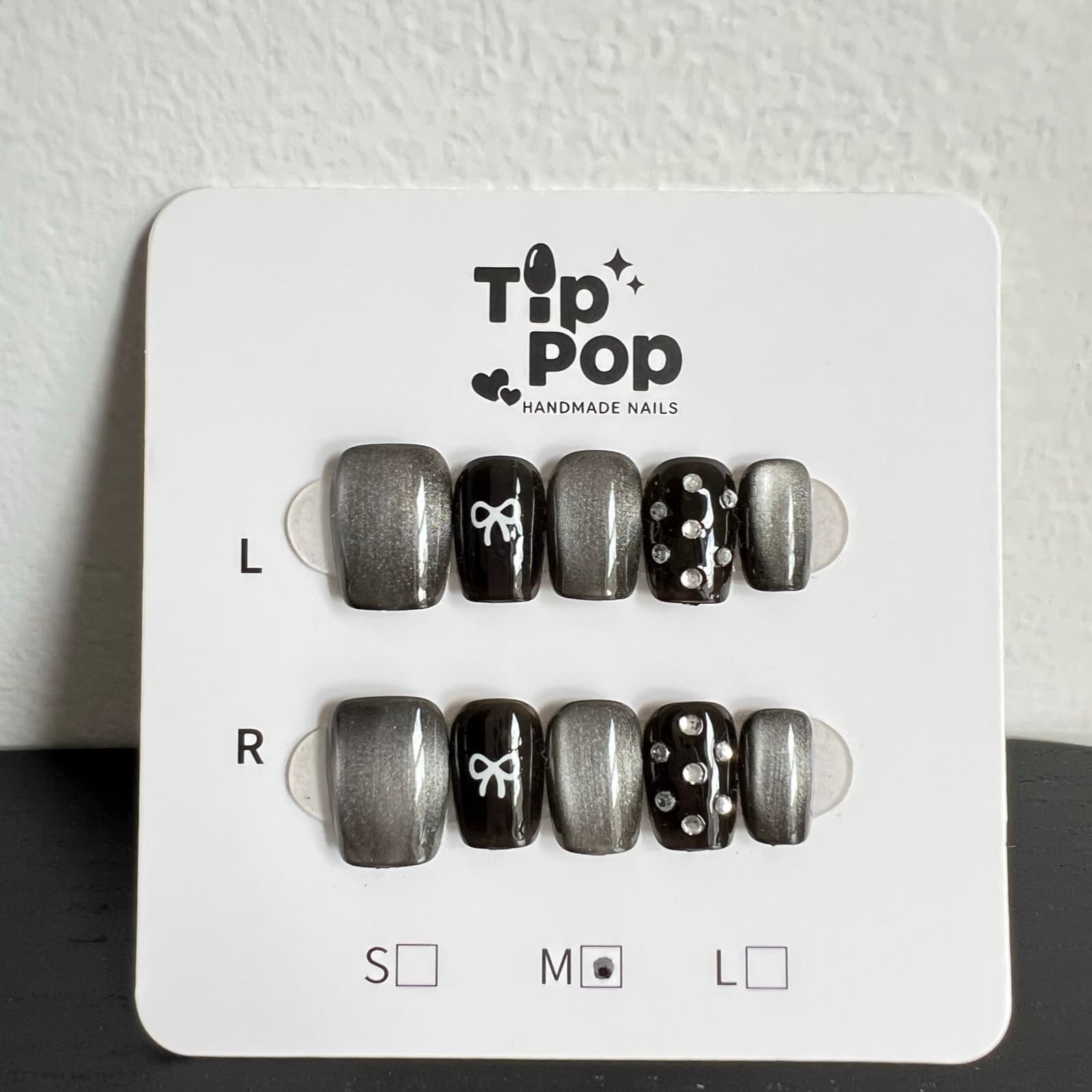 Silver Bow Dot press-on nail set on a TipPop Nails card